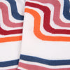 Close-up of colorful striped socks with red, orange, and blue patterns.