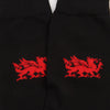 Black socks with red dragon designs on a white background
