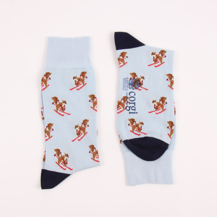 Two  pale blue socks with squirrel designs with a navy heel and toe 