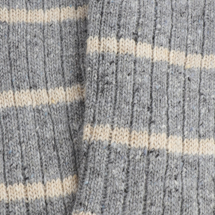 Close-up of pale blue and beige striped fabric texture