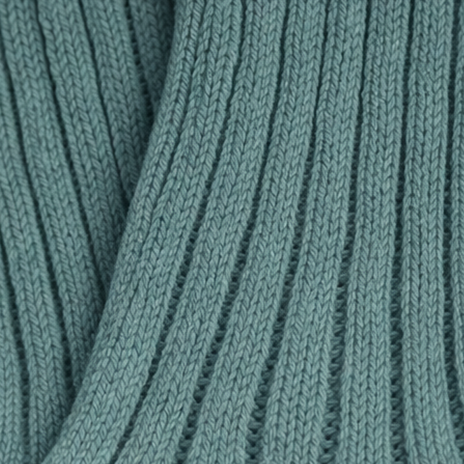 Close-up of teal knitted fabric texture