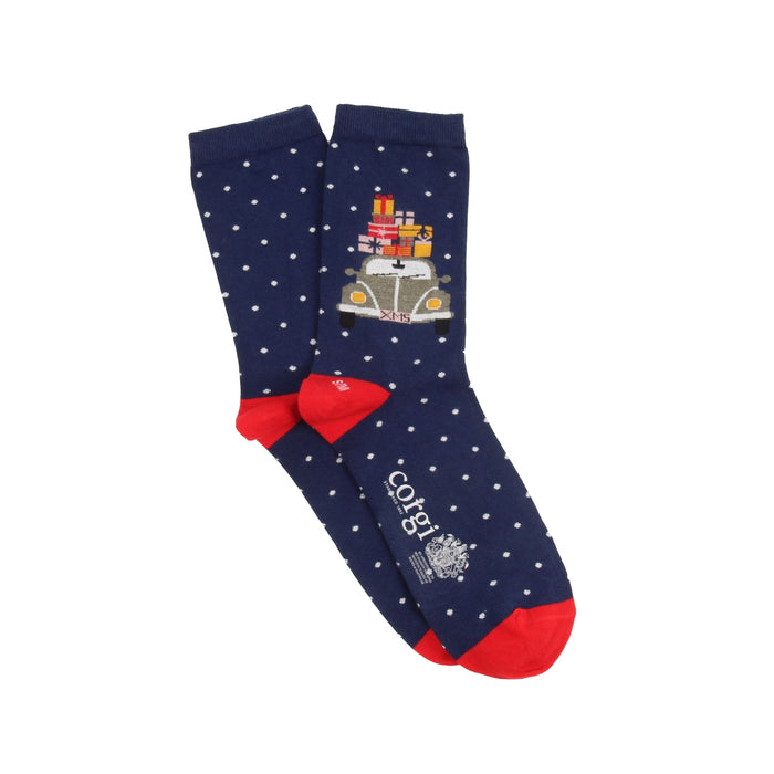 Navy blue socks with white polka dots, red bow, and vintage car design on a white background