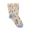 Beige socks with tropical pattern and blue heel and toe photographed  on a white background