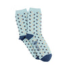 Light blue socks with tiny blue and yellow pelican patterns photographed on a white background