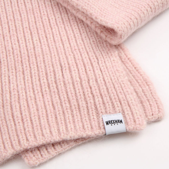 Pink knitted item with a 'Wrexham' label on a white background