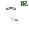 A pair of white crew socks with red and green stripes on the calf, featuring text 'RED WALL' and the flag of Wales.