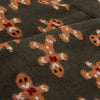 Gingerbread man pattern on a dark background