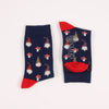 Pair of socks with gnome and mushroom pattern on a white background