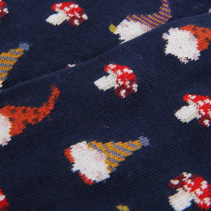 Patterned fabric with colourful mushroom design on a dark blue background