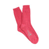 Pink sock with a brand logo on a white background