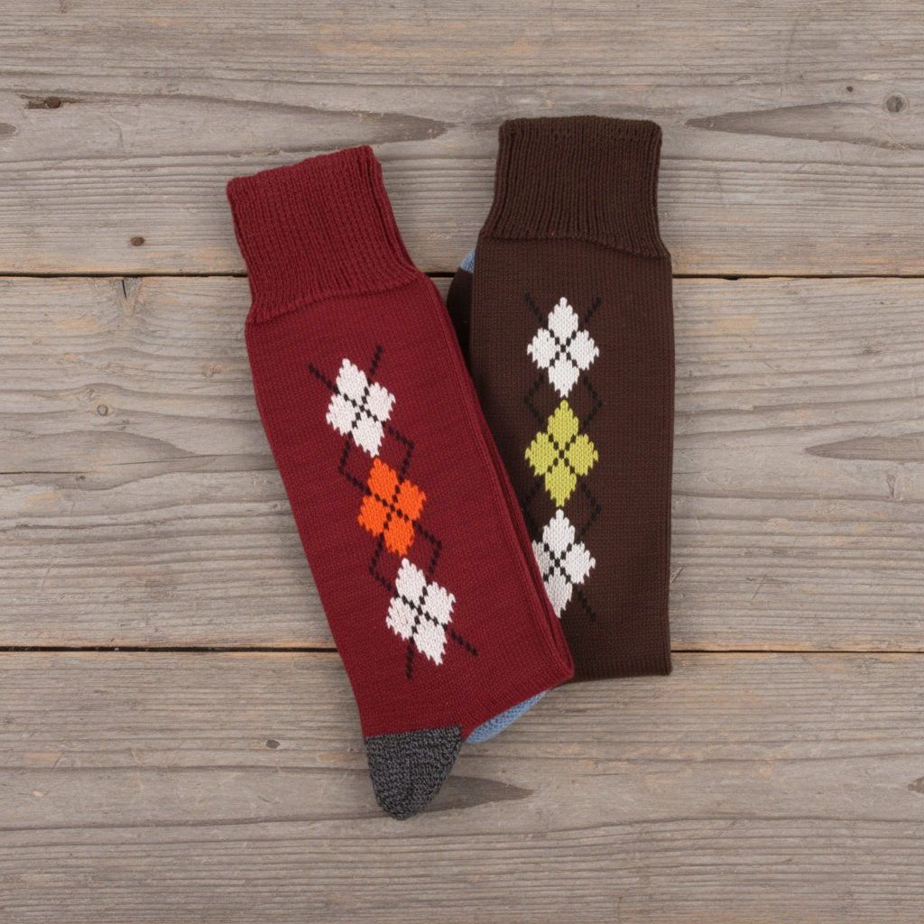 Two pairs of knit calf socks displayed on a clean white background. One pair is burgundy with an argyle pattern in white, orange, and black, and the other is dark brown with an argyle pattern in white, yellow-green, and black.