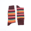 Colourful mix of red striped socks with port cuffs, heel and toe photographed on a white background