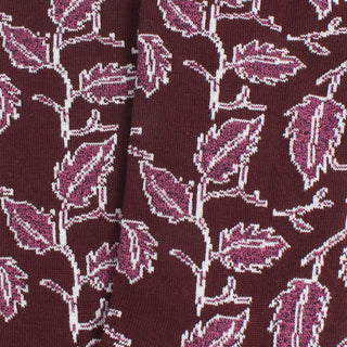 Close-up of fabric with a leaf pattern on a dark background