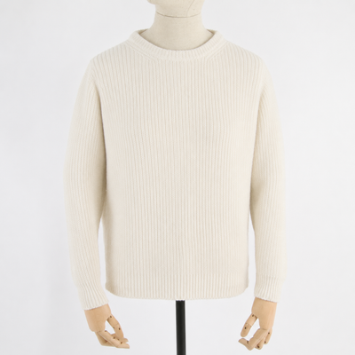 Beige sweater on a mannequin against a white background