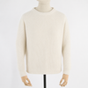 Beige sweater on a mannequin against a white background