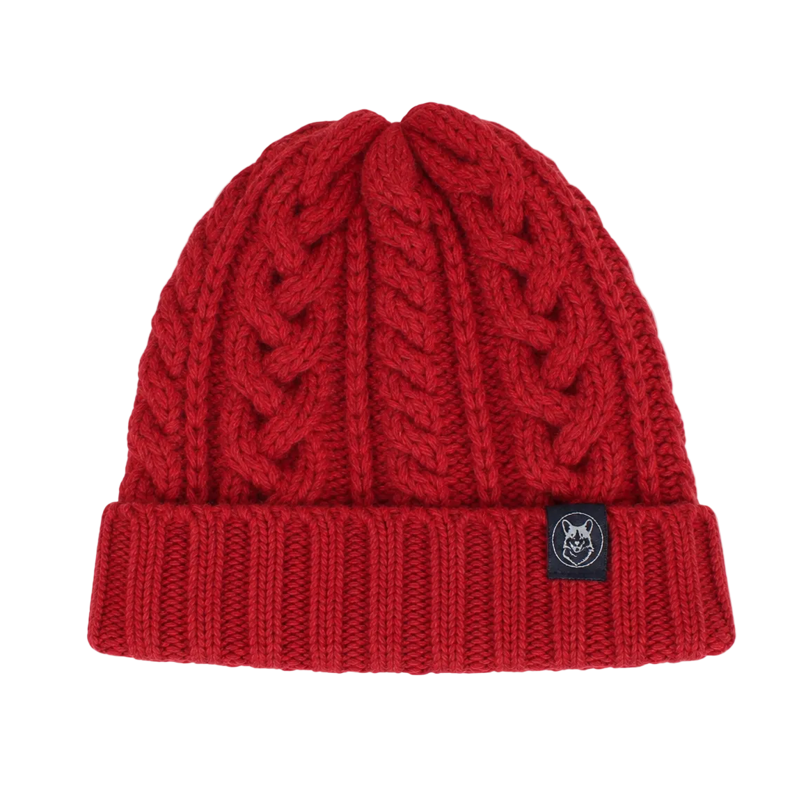 A red cable-knit beanie hat with a folded cuff and a small black brand patch on the side, shown against a light gray background.