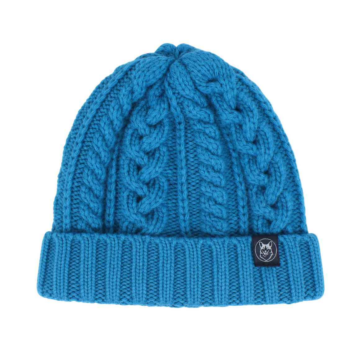 A bright blue cable-knit beanie hat with a folded cuff, featuring a small black brand patch on the side, set against a plain light gray background.