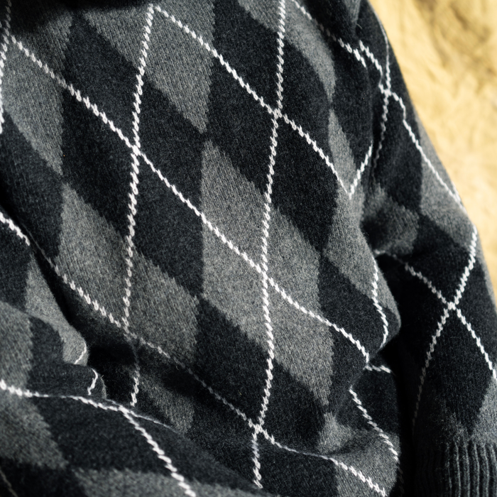 Close-up of black fabric with white diamond pattern