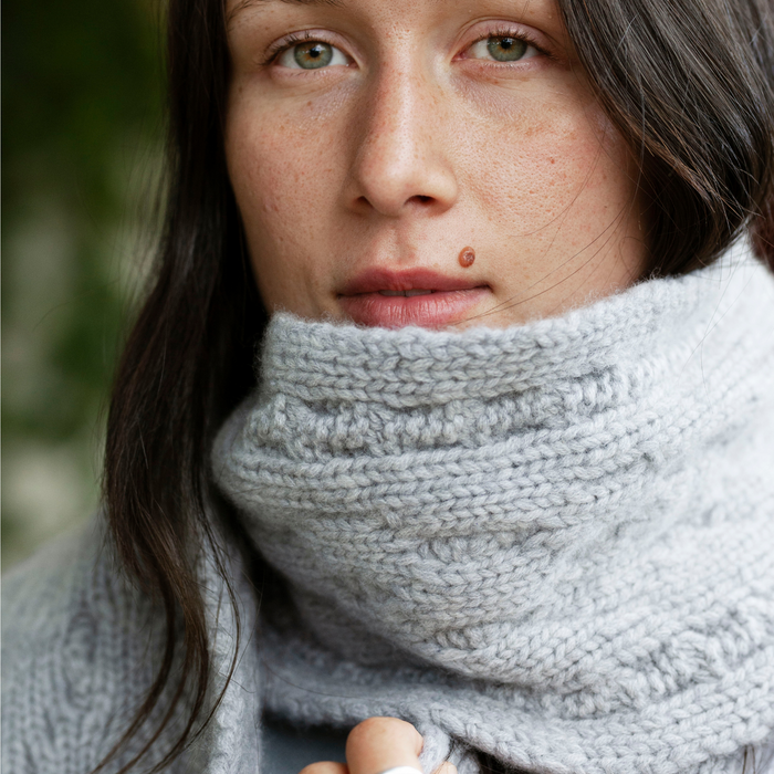 person wearing a cashmere grey scarf