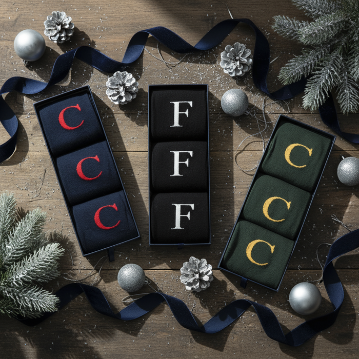 Men's Letter Socks in gift boxes on a festive table.