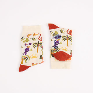 Colourful socks with tropical designs on a white background