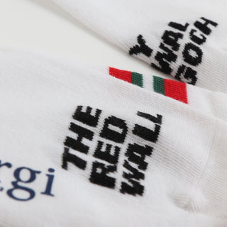 White socks with black text and red, green stripes on a white background