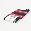 Folded black socks with red and green stripes on a white background