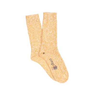 Pair of yellow socks with a brand logo on a white background