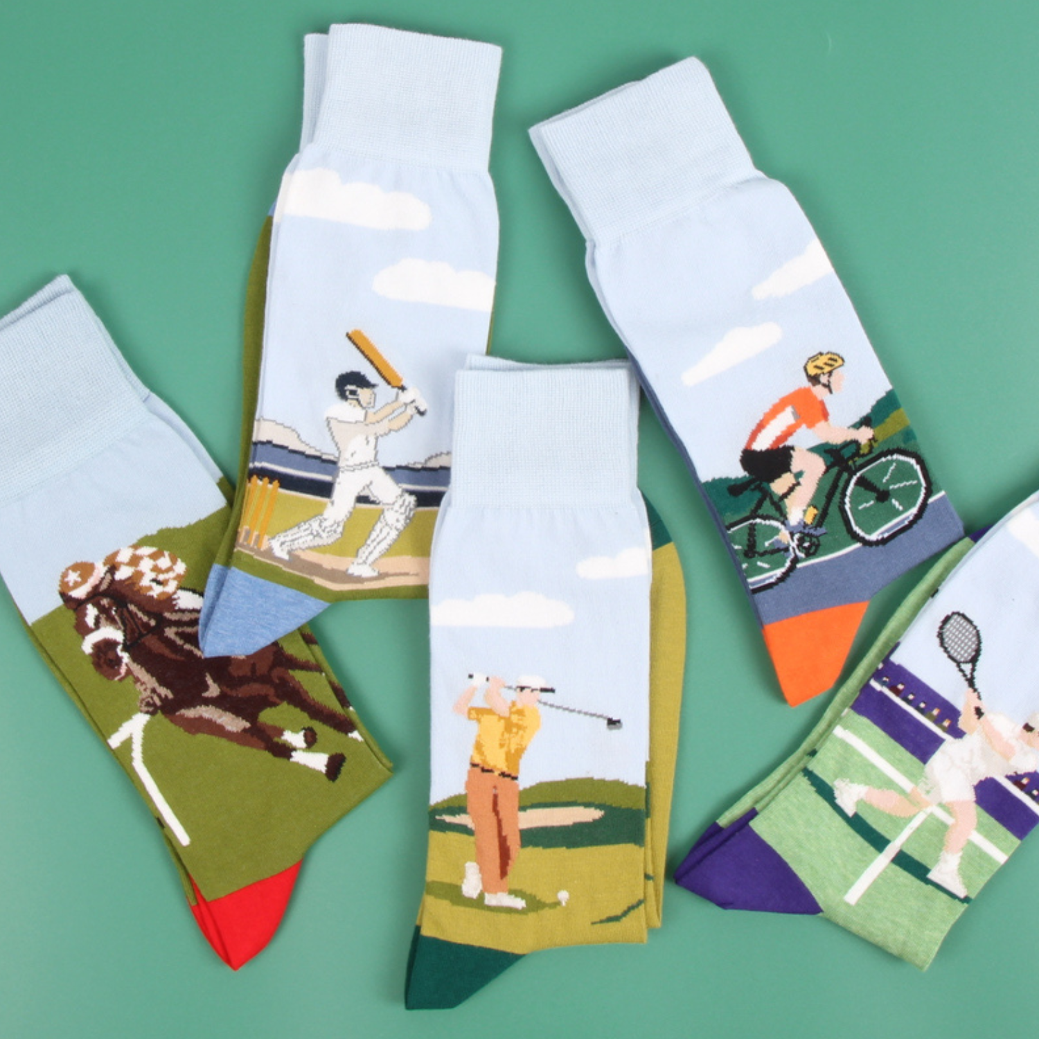 Collection of sports themed socks on a green background.