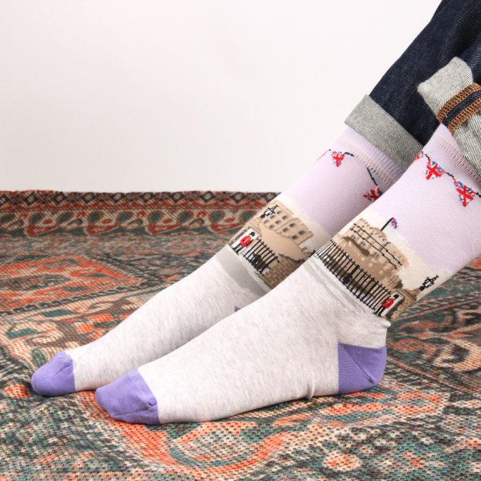 Pair of socks with a unique pattern on a textured surface