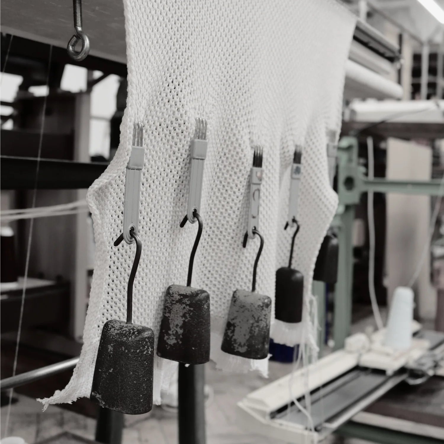 Textile production process with fabric and machinery in a factory setting