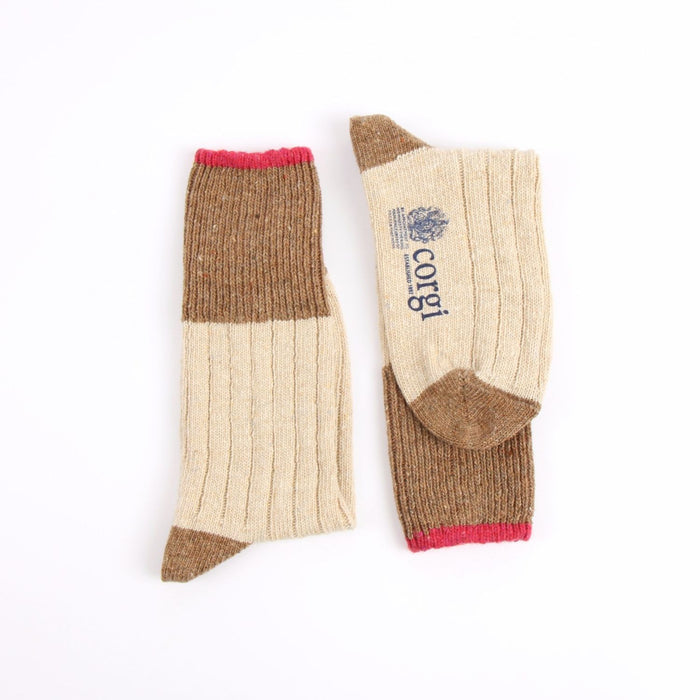 Pair of brown and beige leg socks with a visible brand logo on a white background