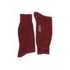 Pair of maroon socks with a brand logo on a white background