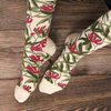 Floral-patterned socks on a wooden surface