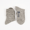 Pair of gray socks with 'corgi' text on a white background