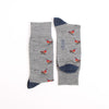 Gray socks with red bird pattern on a white background
