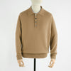 Beige sweater on a mannequin against a white background