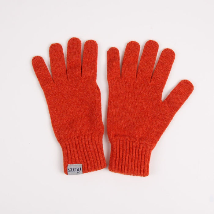 Pair of red gloves with a visible brand tag on a white background

