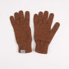 Pair of brown gloves with a visible brand label on a white background

