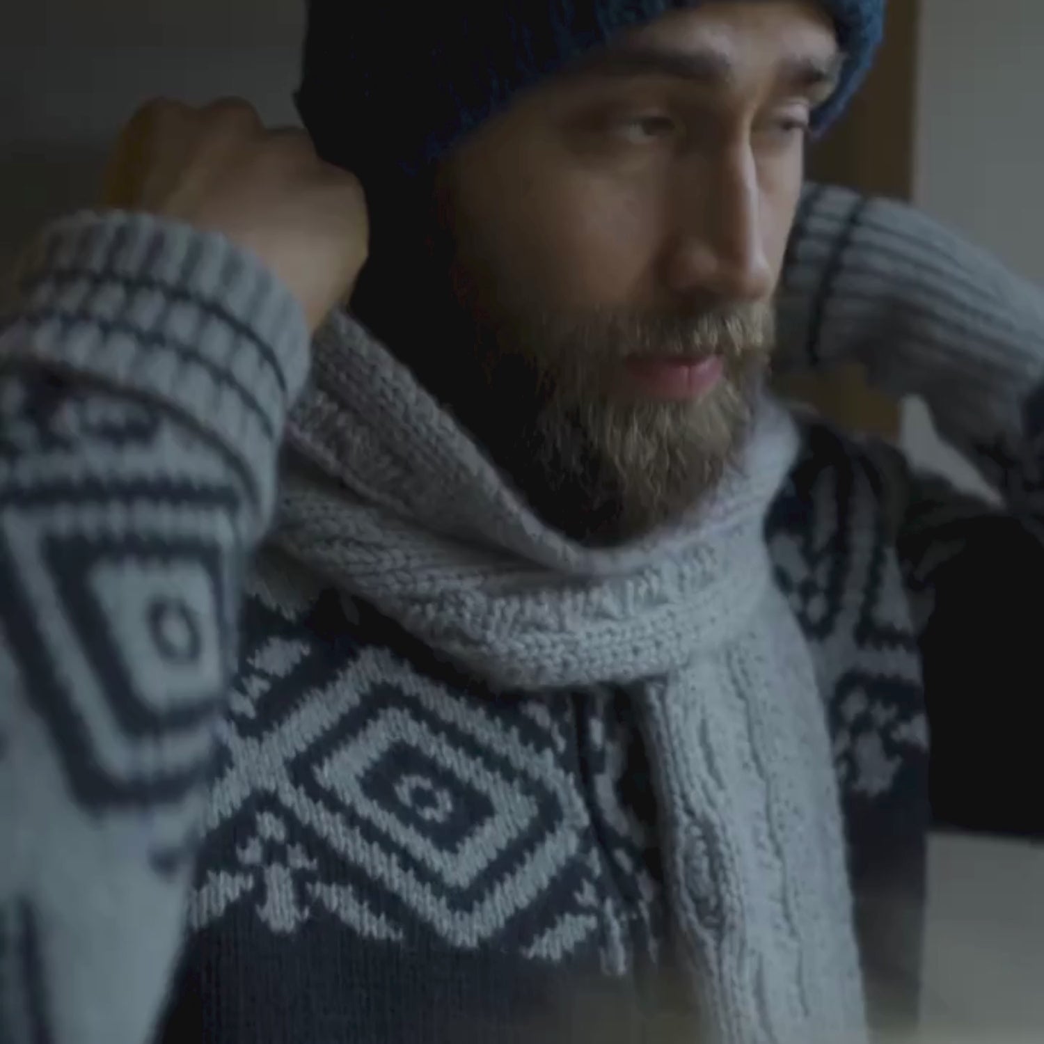 video of a person wearing the cashmere blend cable scarf