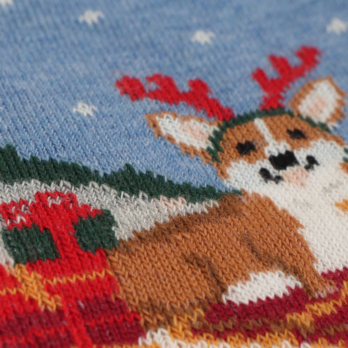 A pair of kids' Christmas themed cotton socks featuring a corgi dog design with holiday decorations .