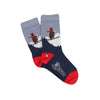 A pair of children's socks with a skiing bear design, featuring a blue colour scheme, red heel, and the brand name 'Corgi' on the foot.